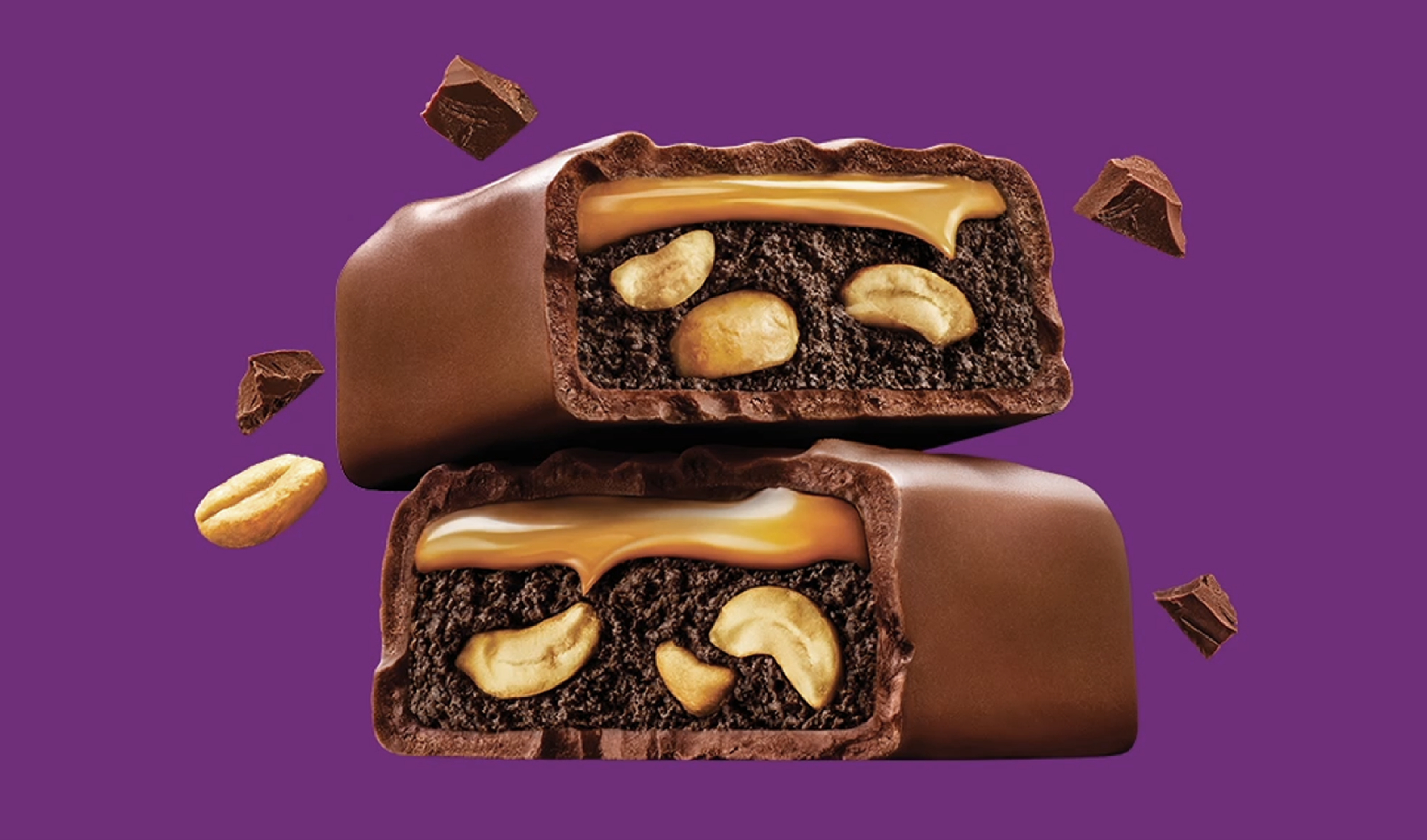 Two stacked, cross-sections of Snickers brownie bar squares
