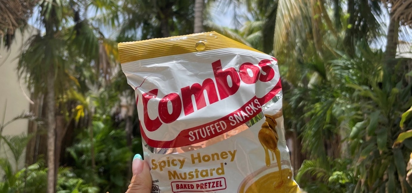 Bag of Spicy Honey Mustard Combos with palm trees in the background
